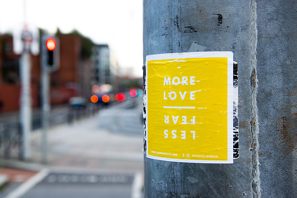 more-love-less-fear-sticker-on-post-unsplash-photo