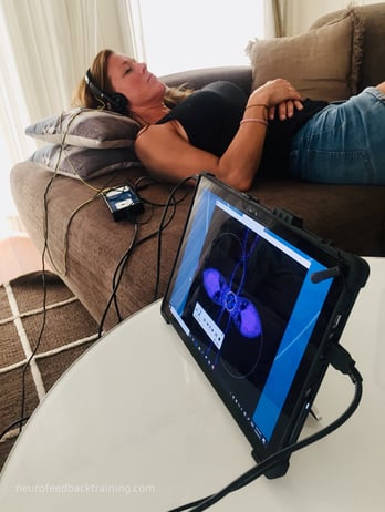 woman sleeping during neuroptimal neurofeedback session